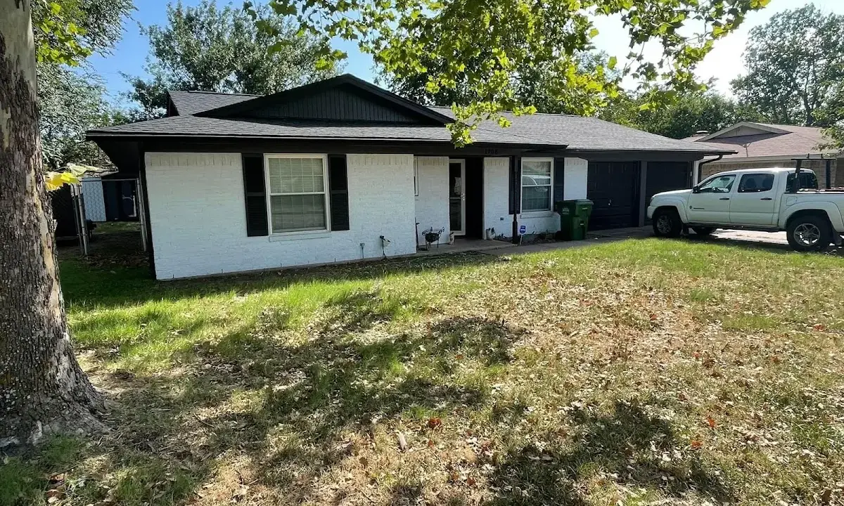 Professional roofing crew working on a residential roof in Little Rock